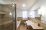En suite facilities include bath tub and walk-in shower